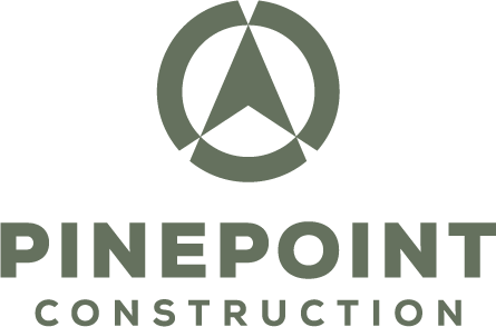 PinePoint Construction Logo with a green directional icon